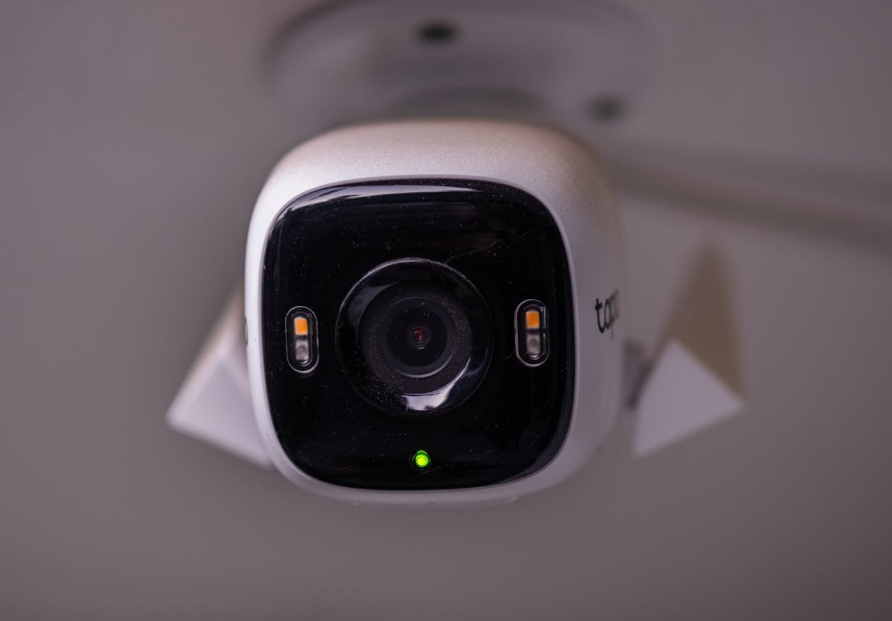 our-story Detailed view of a modern security camera installed indoors in İzmir, Türkiye.